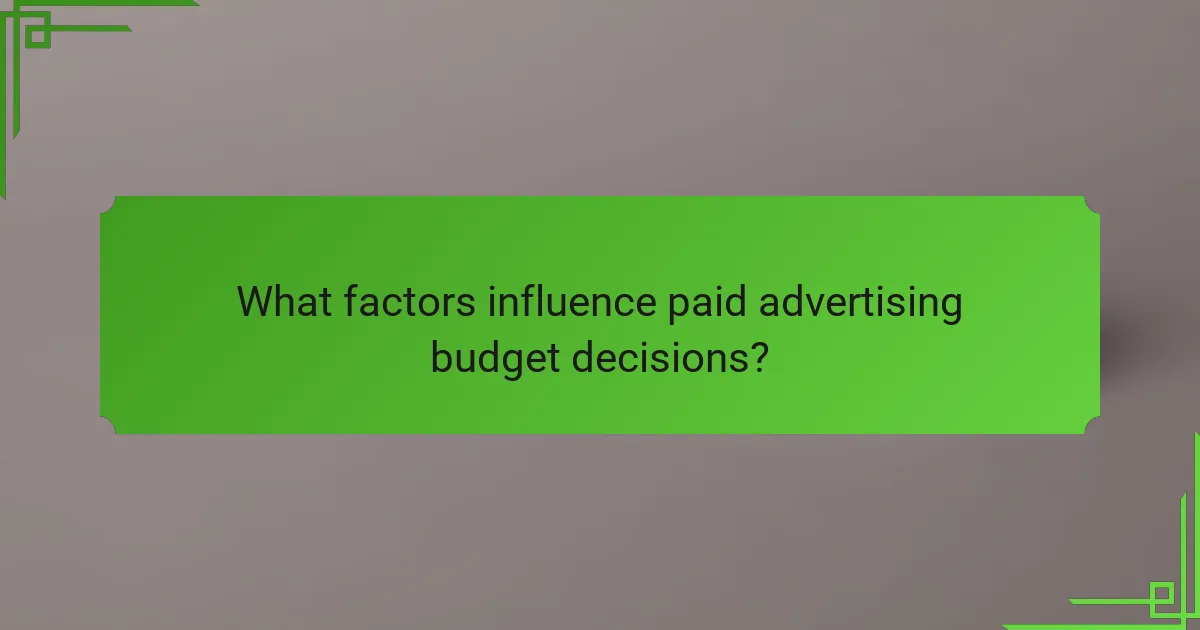 What factors influence paid advertising budget decisions?